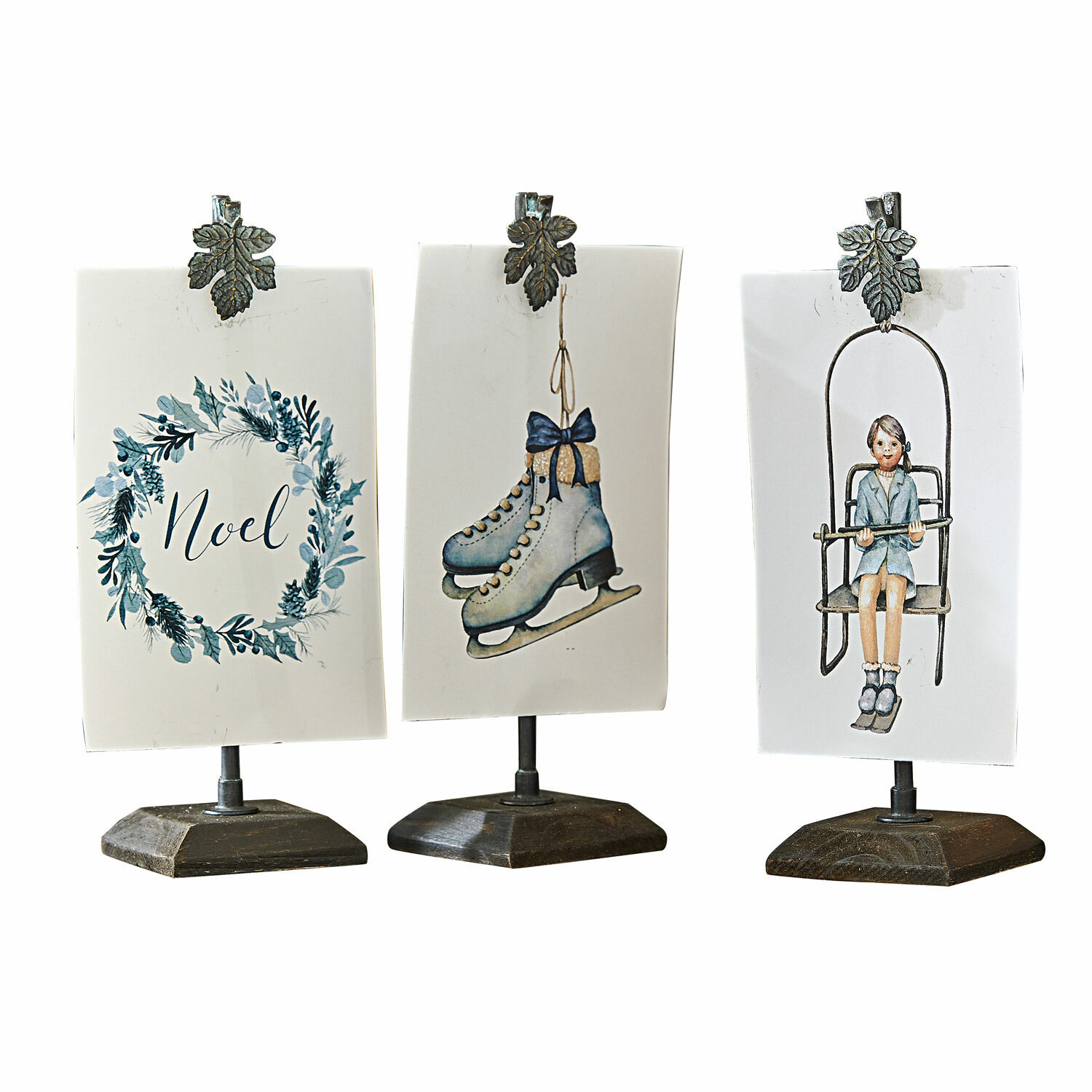 Bild mit Halterung 3er Set Herveline Drei Weihnachtsdekorationen auf Ständern mit Metallklammern, Motiven Schlittschuhe, Mädchen und Schriftzug Noel