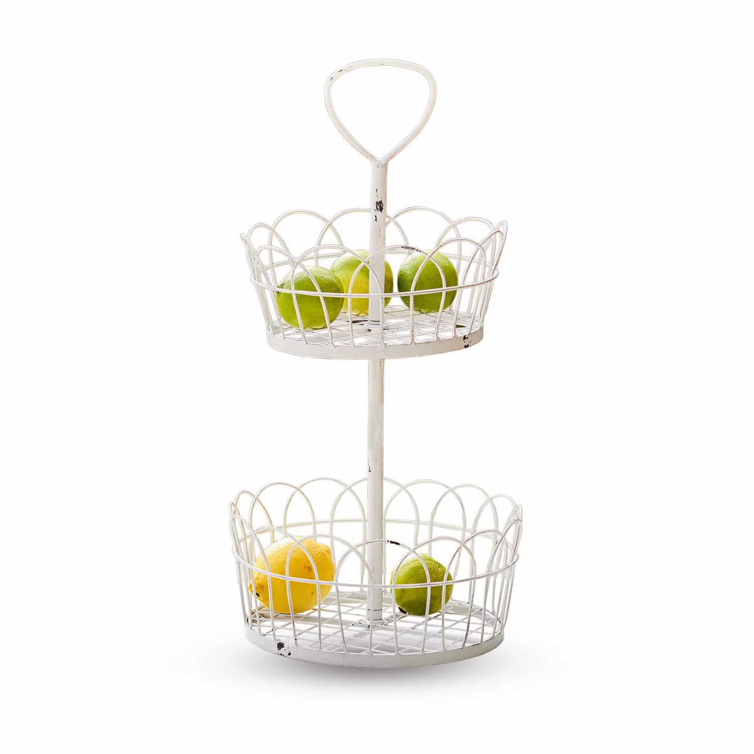Zweistöckiger weißer Metall-Obstkorb mit Zitronen und Limetten für die Küche