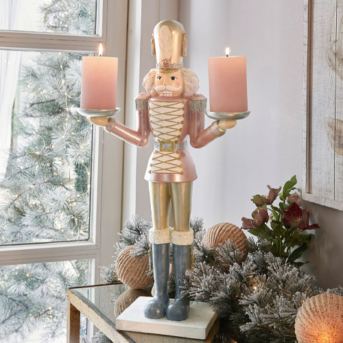 Dekorativer Nussknacker-Kerzenhalter in Rosa und Gold für festliche Weihnachtsdeko