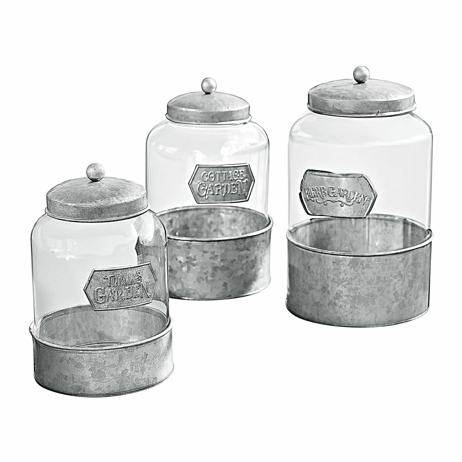 Set aus drei Glasbehältern mit grauen Metalldeckeln und Böden, Gartendekoration