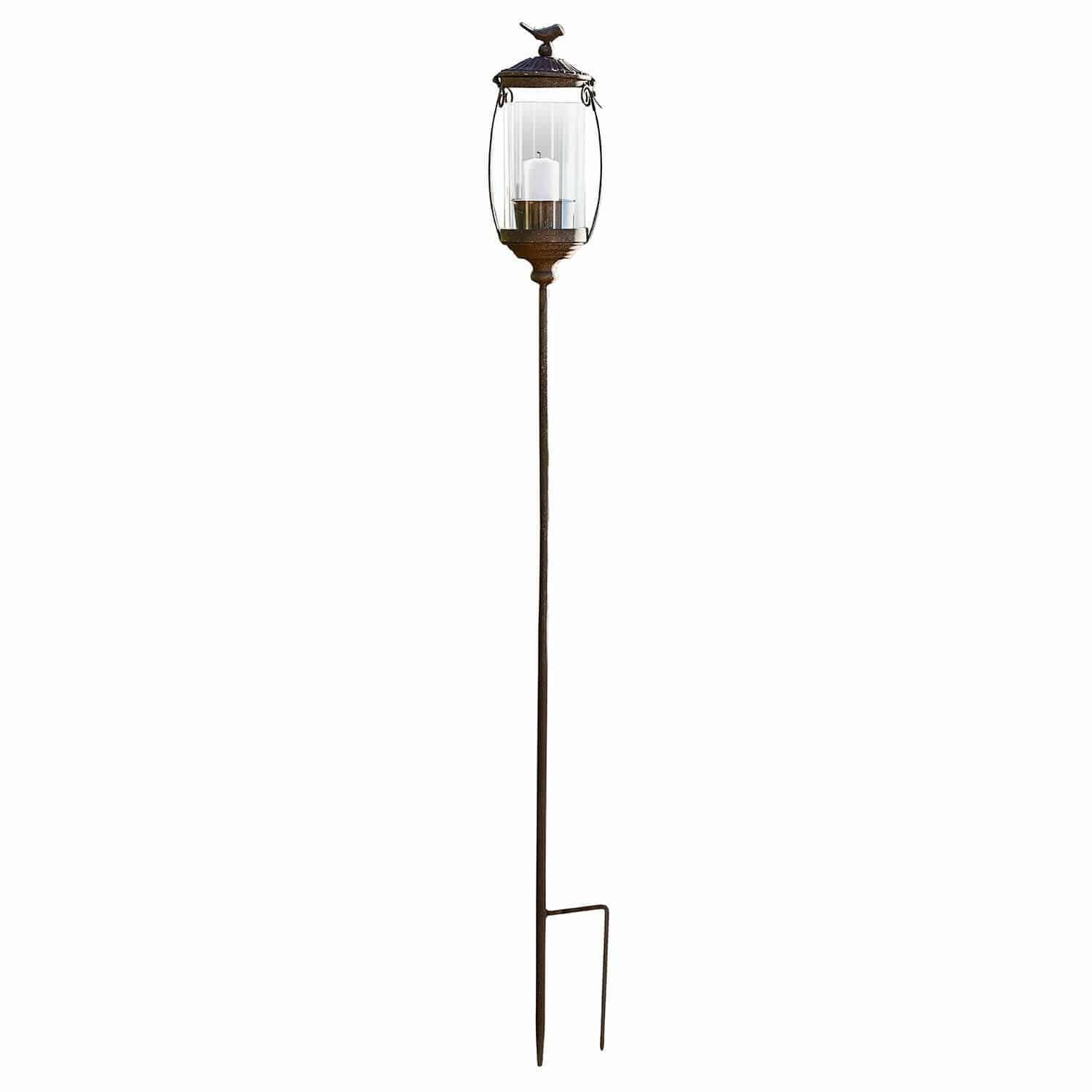 Laterne Nexoril Dekorative Gartenlaterne aus braunem Metall mit klarem Glas und weißer Kerze auf Erdspieß