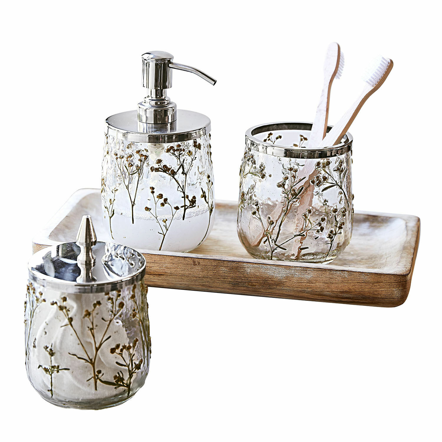 Bad-Set Elorisse Badezimmer-Set aus Glas mit getrockneten Blumenmotiven und Metallakzenten auf Holztablett