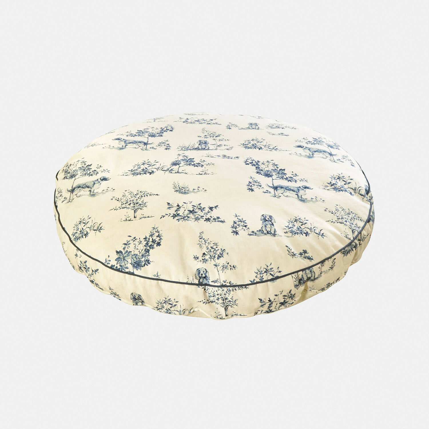 Rundes Baumwollkissen in Creme mit blauem Hunde- und Pflanzenmuster als Dekoration