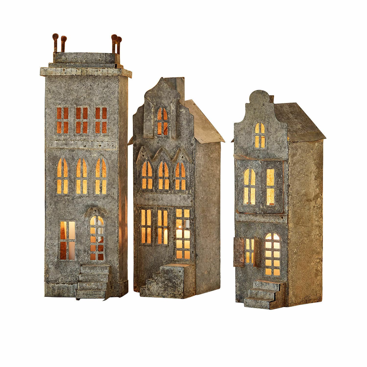 Set aus drei Metall-Laternen in Hausform mit warmem Licht, dekorative Wohnaccessoires