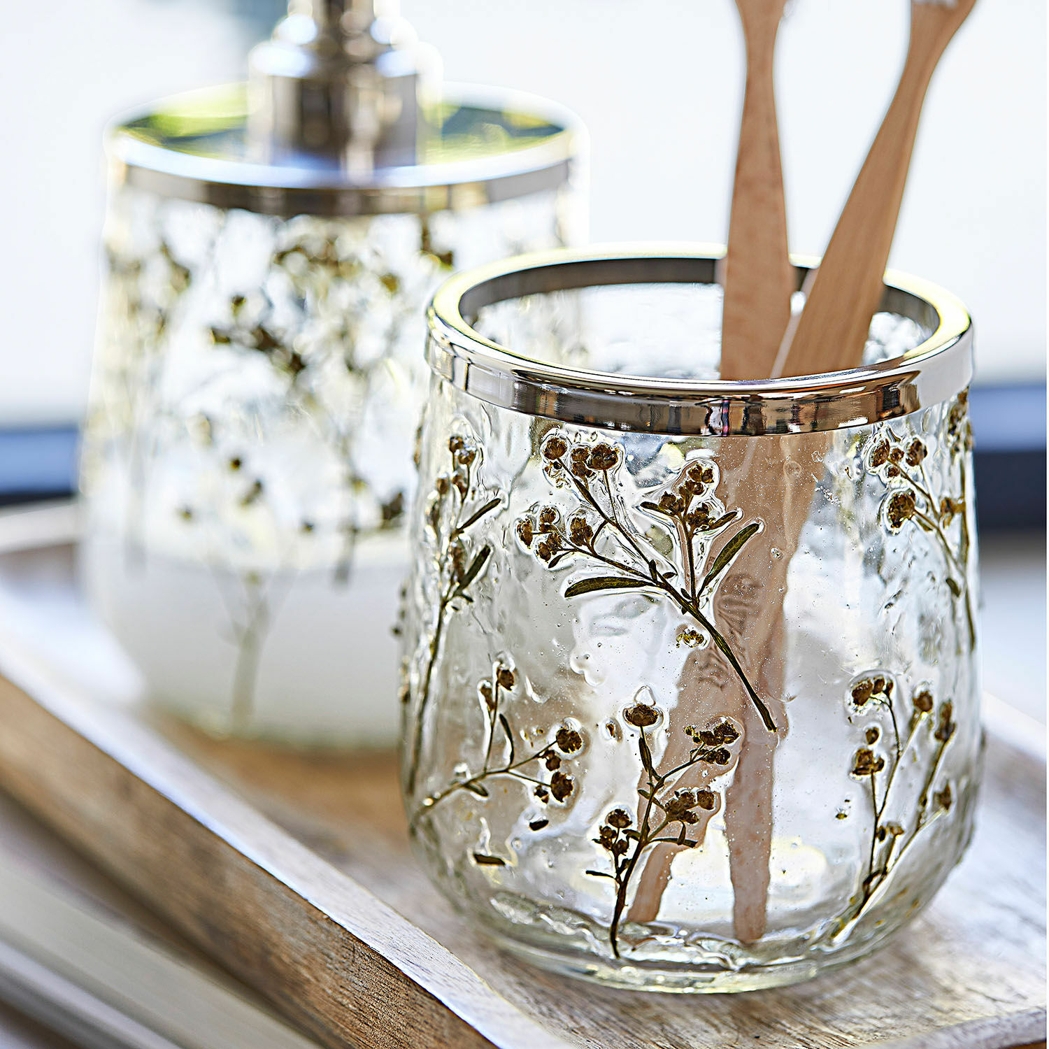 Glasbehälter mit Metallrand und floralem Dekor, ideal für Küche oder Badezimmer