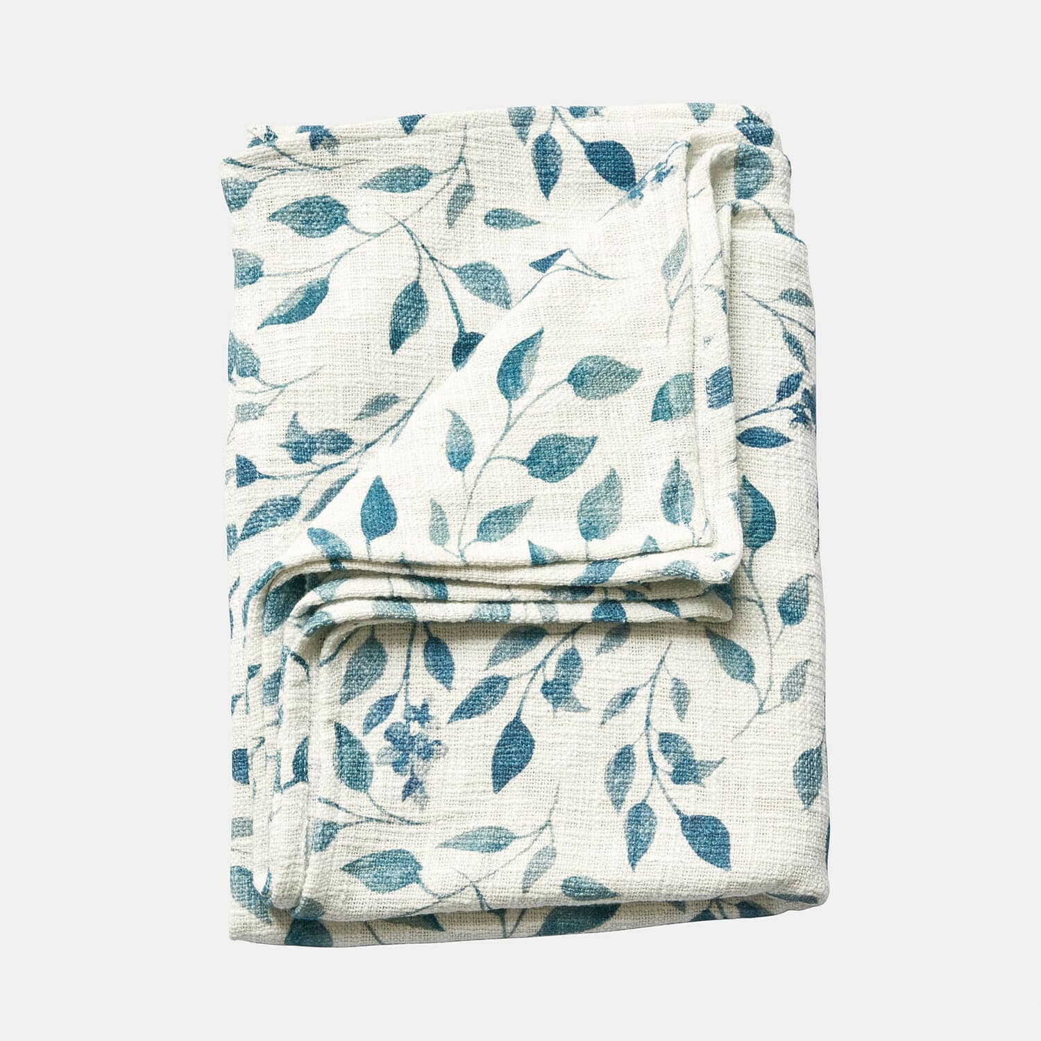 Gefaltete weiße Decke mit blauem Blattmuster, weiches Material, dekorativer Heimtextilartikel