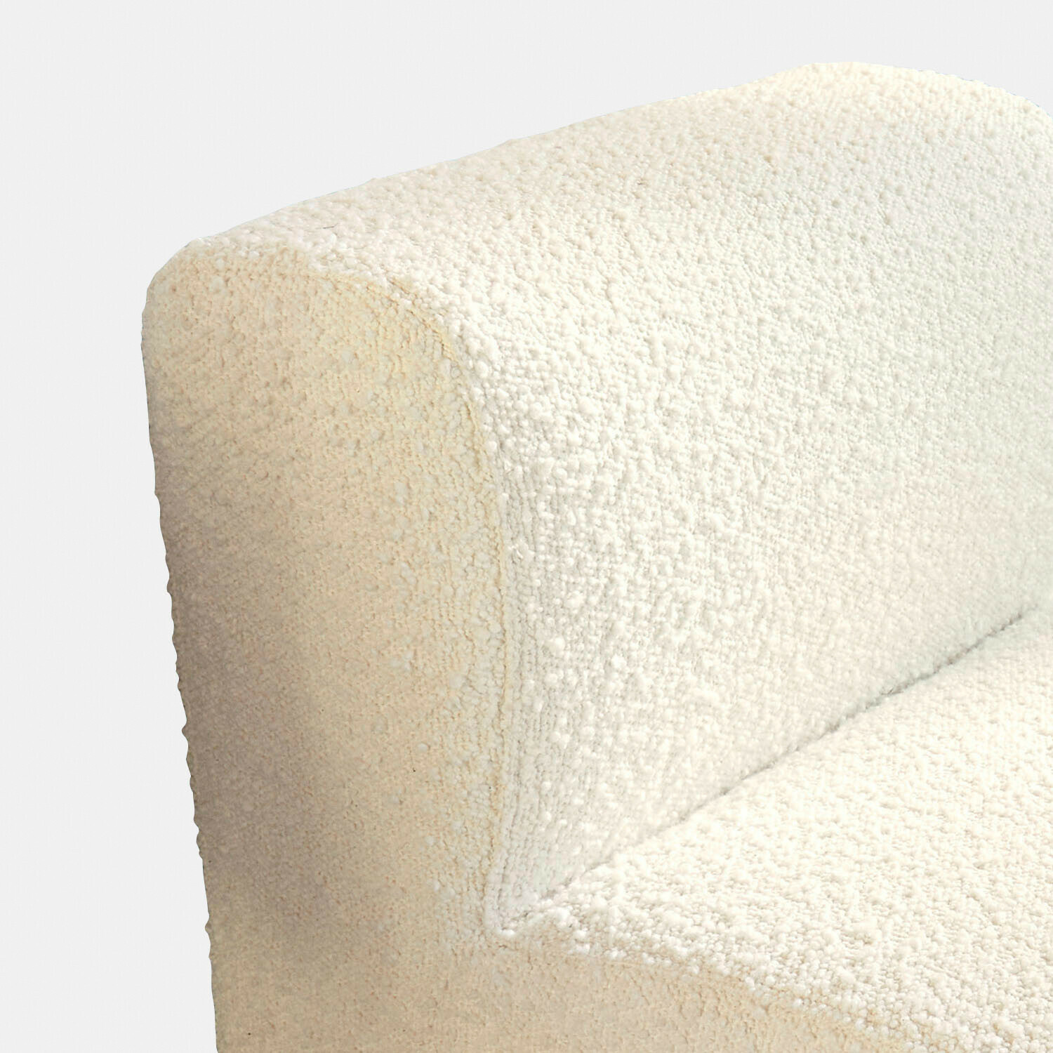 Cremefarbener Sessel aus weichem Bouclé-Stoff mit abgerundeter Form, moderner Wohnzimmerstuhl