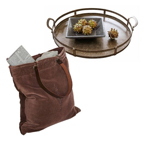 Braune Stofftasche mit Ledergriffen und dekoratives Metalltablett mit Kastanien mit Stacheln