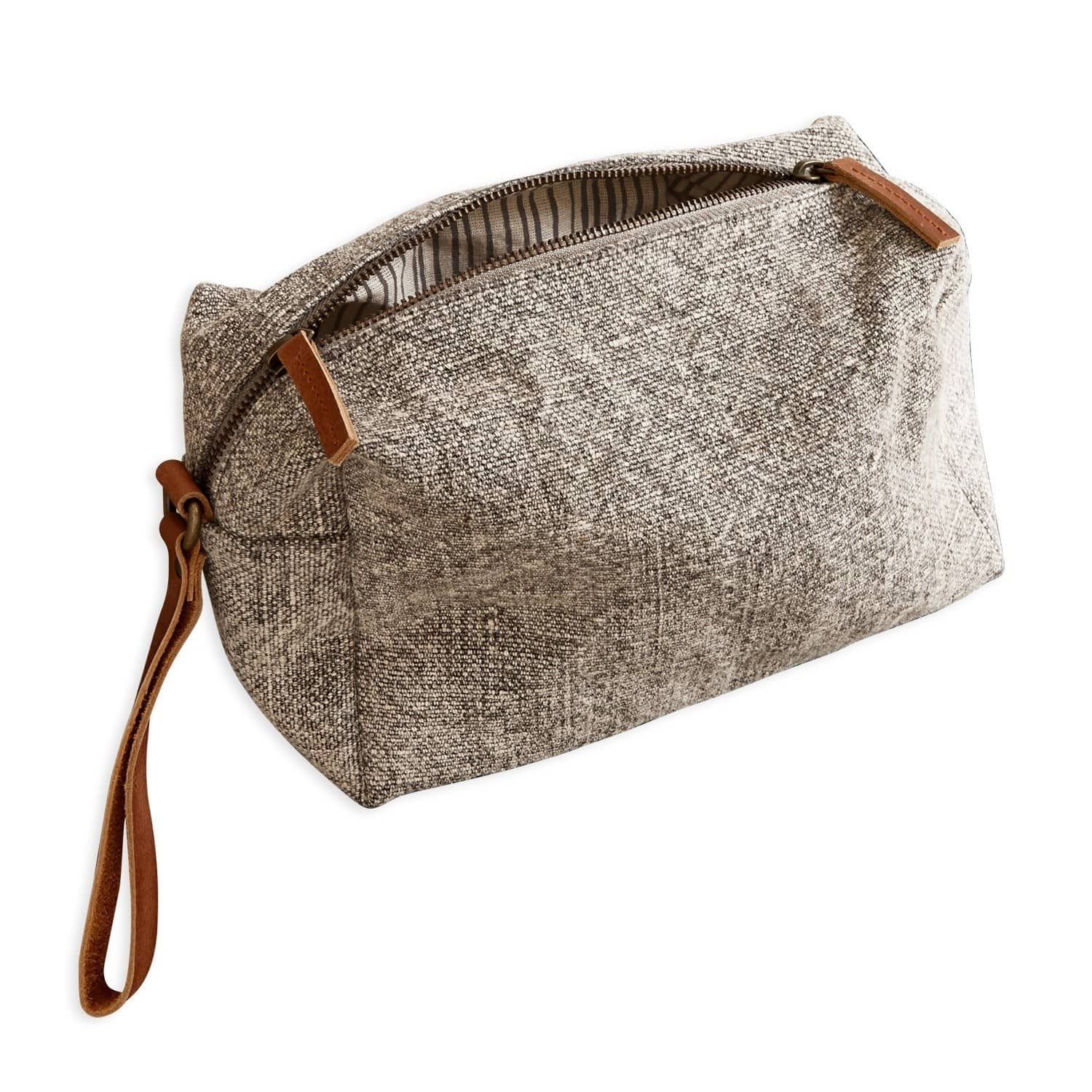 Beige Kosmetiktasche aus Stoff mit braunem Ledergriff und Reißverschluss