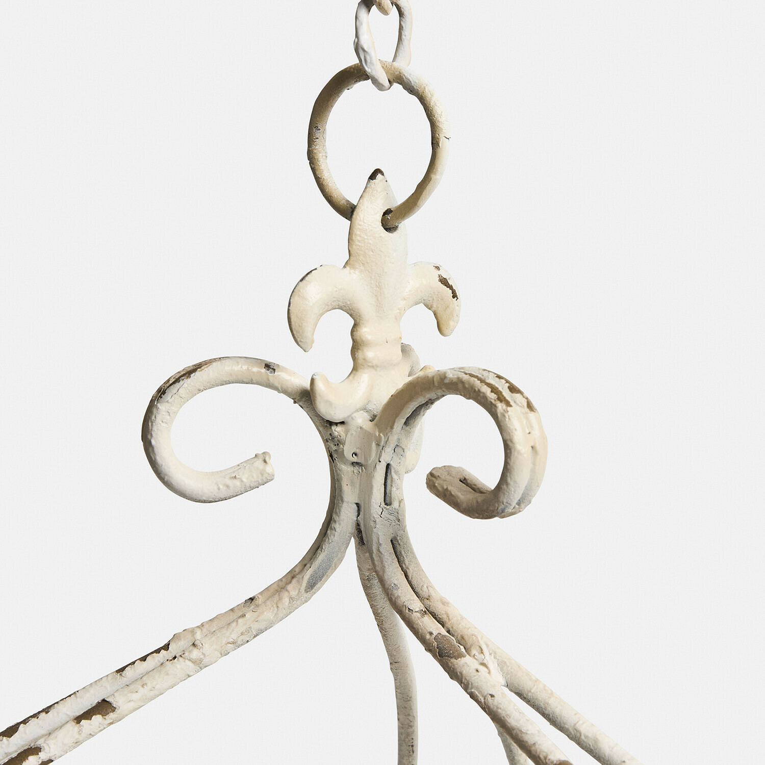 Weißer Metallhaken mit Lilienmotiv, antiker Look mit Gebrauchsspuren und Roststellen