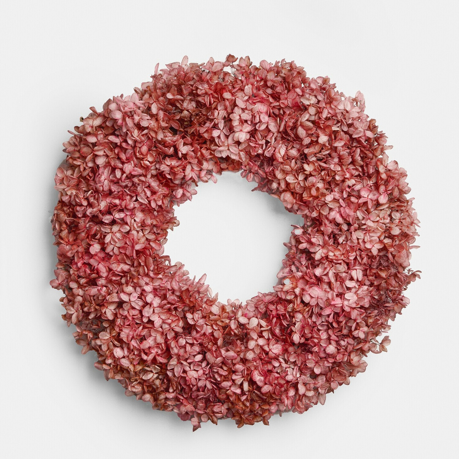 Dekorativer Kranz aus getrockneten rosa Blüten, natürliche Wand- oder Türdekoration
