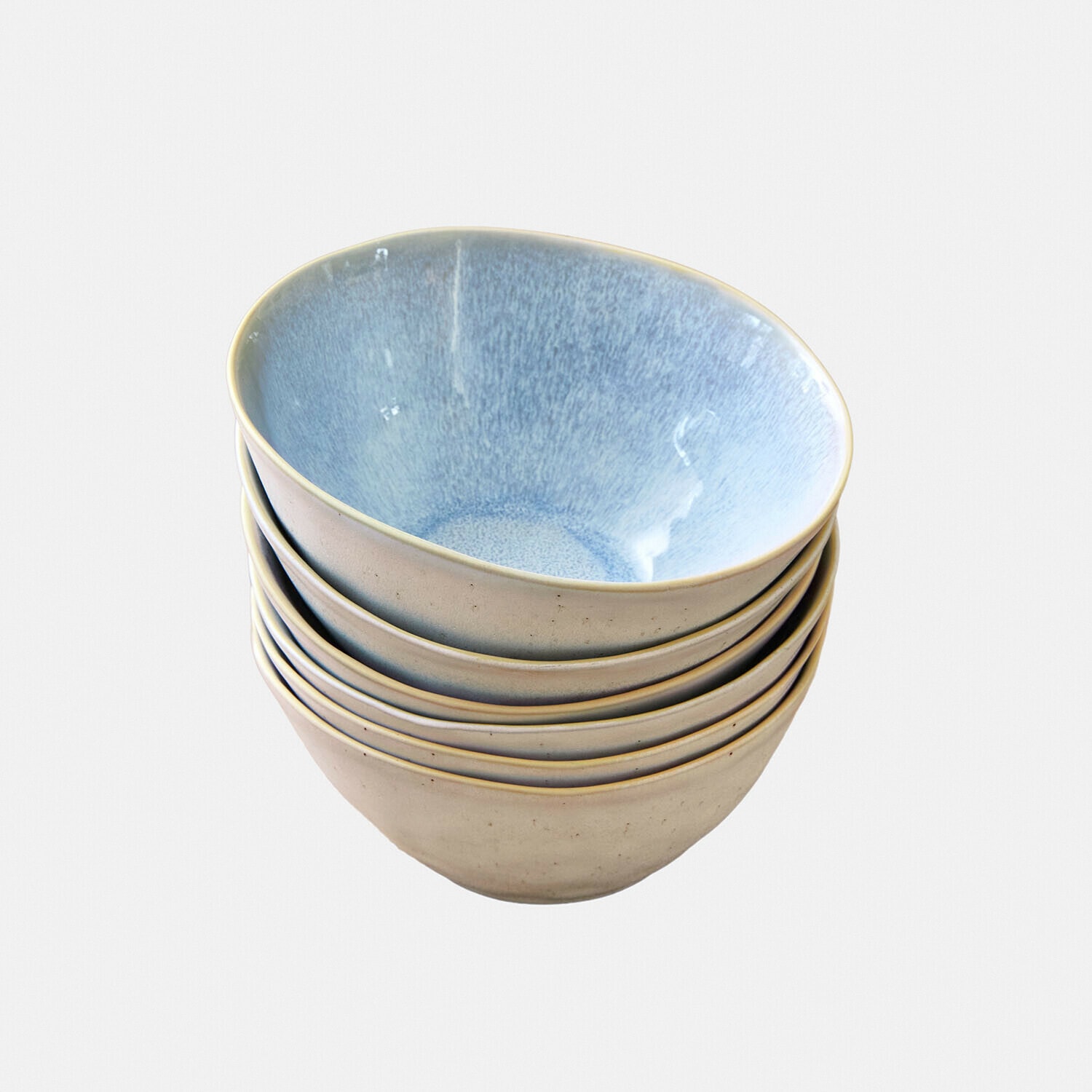 Set aus sechs Keramikschalen in Beige mit blauem Innenraum, ideal zum Servieren von Suppen